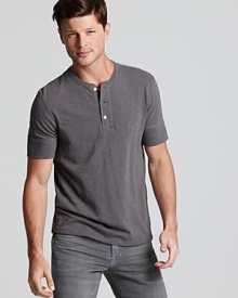A step-above essential from Vince. The soft cotton henley tee is rendered in a slub pattern and partially concealed button placket and banded sleeves. A step-above essential from Vince. The soft cotton henley tee is rendered in a slub pattern and partially concealed button placket and banded sleeves.