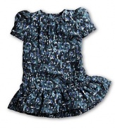 Just for the frill of it, this floral dress features cute cap sleeves and ruffled dropped hem.