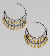 Delicate double hoops of blackened sterling silver dangle tiny beads of 18k gold in this delightful design.18k gold Sterling silver Diameter, about ½ Post back Imported