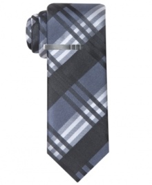 Subdued plaid still makes a solid statement with this Alfani RED silk tie. Subdued plaid still makes a solid statement with this Alfani RED silk tie.