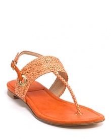 Woven leather in a tropical hue has us dreaming of island sunsets. By Stuart Weitzman.