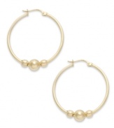 An elegant addition. Giani Bernini makes a stylish statement with its hoop earrings, featuring three beads to enhance the appeal. Set in 24k gold over sterling silver. Approximate diameter: 1-1/4 inches.