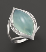 Faceted white sapphires surround a gleaming seafoam chalcedony cabochon, set in sterling silver. By Elizabeth Showers.