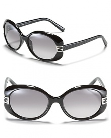 Retro-inspired round frame sunglasses with signature Fendi logo detail at temples.