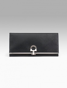 Saffiano texture leather wallet with silvertone signature Gancini clip closure. Opens to ID window, seven credit card slots, four bill slots and zip change compartment. Lined. 4Hx7½L. Made in Italy. Saffiano texture leather wallet with silvertone signature Gancini clip closure. Opens to ID window, seven credit card slots, four bill slots and zip change compartment. Lined. 4Hx7½L. Made in Italy.