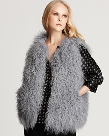 A plush long-haired lamb vest from Joie is a luxurious addition to your fall wardrobe, taking everyday looks from stylish to sensational. A plush long-haired lamb vest from Joie is a luxurious addition to your fall wardrobe, taking everyday looks from stylish to sensational.