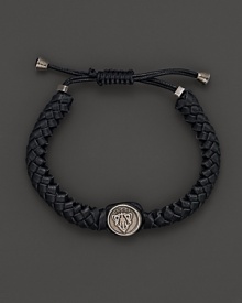 Aged sterling silver forms an iconic Gucci crest, framed by brained black leather.