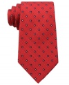 A bold pattern make this Tommy Hilfiger silk tie pop for a look that's sure to get you noticed.