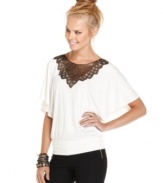 A sequin applique turns up the cool dial on this batwing sleeve blouson top from Urban Hearts!