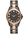 An eye-popping blend of color summons instant attraction with this Marc by Marc Jacobs watch. Crafted of gray and rose-gold ion-plated stainless steel bracelet and round case. Rose-gold tone bezel. Gray dial features rose-gold tone cut-out text logo at hour markers, rose-gold tone three hands and logo at twelve o'clock. Quartz movement. Water resistant to 50 meters. Two-year limited warranty.