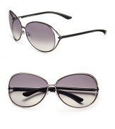 Round modified metal frames with open-end lens and tubular temples. Available in shiny gunmetal with grey gradient lens.100% UV protection Made in Italy 