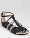 Pretty and plated, these downtown-chic Rachel Zoe sandals don't mess around. Edgy chain details lend effortless cool.