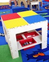 The surface of this sturdy table has colorful panels compatible with Duplo building pieces so it's the perfect place for kids to stack up the blocks and make fantastical creations.Duplo-compatible surfaceLower shelf with four plastic storage bins18 square X 16HWoodMade in USA Please note: Blocks and chairs not included. 