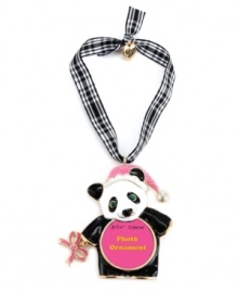 What's black and white and cute all over? Betsey Johnson's panda picture frame ornament! Made in gold tone mixed metal, it features a pink glitter bow accent and Santa hat as well as crystal accents. Hangs from a gingham ribbon. Approximate length: 2-3/4 inches. Approximate drop: 4-1/4 inches. What's black and white and cute all over? Betsey Johnson's panda picture frame ornament! Made in gold tone mixed metal, it features a pink glitter bow accent and Santa hat as well as crystal accents. Hangs from a gingham ribbon. Approximate length: 2-3/4 inches. Approximate drop: 4-1/4 inches.