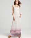 This Gypsy 05 maxi dress offers simplicity in stripes with a colorful surprise ending at the hem.