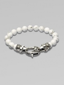 A new look for the modern man, handsomely crafted with a sterling silver raven's head clasp and a string of howlite beads.Sterling silverLobster claspBracelet, 9 longAbout 3 diamImported A new look for the modern man, handsomely crafted with a sterling silver raven's head clasp and a string of howlite beads.Sterling silverLobster claspBracelet, 9 longAbout 3 diamImported