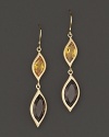 Pavé diamonds frame faceted smoky quartz and orange citrine gems, set in 18K gold leaves. By Carelle.