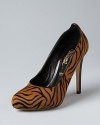 Be a tigress: Jerome C. Rousseau puts his stamp on the exotics trend in tiger-printed haircalf, in pumps with animal appeal.