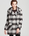 In classic plaid, this DKNY double-breasted coat with oversized pockets makes the perfect top layer to your winter-weekend looks.