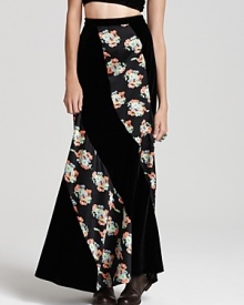 Plush velvet and fresh florals meet for '70s-inspired style on this Free People maxi skirt. Work the floor-sweeping look in romantic fashion--think tall leather boots and a sheer crochet sweater. Plush velvet and fresh florals meet for '70s-inspired style on this Free People maxi skirt. Work the floor-sweeping look in romantic fashion--think tall leather boots and a sheer crochet sweater.