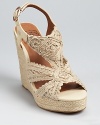A classic espadrille from Lucky Brand, crafted in macrame with luxe leather details.