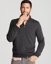 Add refinement to your wardrobe with this super-soft sweater rendered in pure merino wool and furnished with a half zip front for masculine appeal. Layer a colorful or patterned button-down underneath to express your classic style.