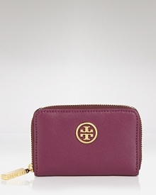 Tory Burch's leather pouch is a petite yet polished choice. Crafted of leather and adorned with a subtle designer plaque, it encapsulates the brand's city sleek approach to accessorizing. Tory Burch's leather pouch is a petite yet polished choice. Crafted of leather and adorned with a subtle designer plaque, it encapsulates the brand's city sleek approach to accessorizing.