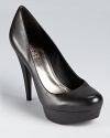 A classic silhouette gets a major lift with a 4.5 stacked heel--in two classic colors, you can't go wrong. From GUESS.