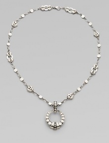From the Dot Collection. An open circle pendant hangs from a sautoir link necklace, all of sterling silver in the distinctive dot design.Sterling silver Chain length, about 18 Pendant diameter, about 1¼ Lobster clasp Made in Bali From the Dot Collection. An open circle pendant hangs from a sautoir link necklace, all of sterling silver in the distinctive dot design.Sterling silver Chain length, about 18 Pendant diameter, about 1¼ Lobster clasp Made in Bali