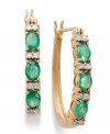 Glam in green. These 14k gold hoop earrings get a sparkling update with oval-cut emeralds (1 ct. t.w.) and sparkling round-cut diamonds (1/8 ct. t.w.). Approximate diameter: 3/5 inch.