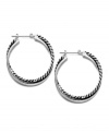 A stylish new spin. Hoop earrings are always a fashionable favorite in jewelry, but this Lauren by Ralph Lauren version literally takes on a modern twist. Set in silver tone mixed metal. Approximate diameter: 1-1/4 inches.