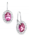 Pink perfection. Victoria Townsend's sparkling drop earrings highlight oval-cut pink topaz (2-1/5 ct. t.w.) surrounded by round-cut diamond accents. Set in sterling silver. Approximate drop: 3/4 inch.