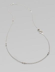 From the Naga Collection. Long enough to double, this graceful sterling silver chain is dotted with pretty shield-shaped links and highlighted by a dramatic curved dragon.Sterling silverLength, about 36Lobster claspMade in Bali From the Naga Collection. Long enough to double, this graceful sterling silver chain is dotted with pretty shield-shaped links and highlighted by a dramatic curved dragon.Sterling silverLength, about 36Lobster claspMade in Bali