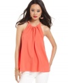 In a brightly bold shade, this RACHEL Rachel Roy twisted halter tank is perfect for dressing up denim!