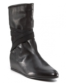 Crisscross elastic straps add edge to the sleek silhouette of these leather wedge boots. By Stuart Weitzman. Crisscross elastic straps add edge to the sleek silhouette of these leather wedge boots. By Stuart Weitzman.