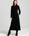 DKNY's timeless black coat exudes elegance with cosmopolitan sensibility.