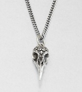 A small raven skull pendant highlights impeccable carving and attention to detail from a sterling silver curb link chain necklace.Sterling silverLength about 24Lobster claspMade in USA