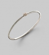 At the center of this slender sterling silver cable is a petite heart, delineated in diamonds. Diamonds, 0.11 tcw Sterling silver Diameter, about 2¼ Made in USA