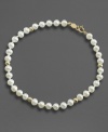 Everyday elegance, fit for any age. This lovely simulated pearl bracelet is accented with 14k gold beads.