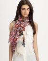 A luxurious blend of silk and cashmere with a wild fauna print. 50% silk/50% cashmereAbout 28 X 80Dry cleanImported 