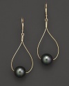 Sleek gold teardrops pierce black Tahitian pearls.