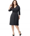 A ruched waist and A-line shape lend a flattering fit to NY Collection's three-quarter sleeve plus size dress, accented by a pleated skirt.