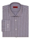 A classic-fit HUGO dress shirt touts traditional barrel cuffs and timeless plaid for effortless office polish.