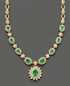 Establish everlasting elegance with this royalty-inspired necklace by Effy Collection. Filled with lovely detail, this necklace features oval and round-cut emeralds (3-3/8 ct. t.w.) and round-cut diamonds (2-1/3 ct. t.w.) set in 14k gold. Approximate length: 16 inches. Approximate drop: 1 inch.
