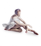 To the point. This elegant ballet dancer from Lladro extends her toes in a graceful stretch, holding the pose and a single rose, in handcrafted porcelain.