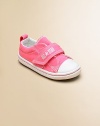 Cute, comfy classics with grip-tape closure that'll add a pop of color to any ensemble.Grip-tape closureCanvas upperCanvas liningRubber soleTraditional Chuck insoleImported