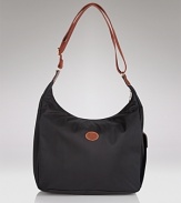 Longchamp's nylon hobo is a fuss-free take on a classic shape. Carry the pretty-practical style to add an enviable dose of Parisian chic to everyday looks.