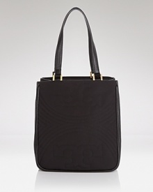 The perfectly proportioned tote in stitched leather. Effortless accessorizing takes a trip uptown with this bag from Tory Burch, accented by a bold buckle closure. The perfectly proportioned tote in stitched leather. Effortless accessorizing takes a trip uptown with this bag from Tory Burch, accented by a bold buckle closure.