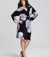 Gorgeous oversized blooms beautify the LBD. This Melissa Masse dress features a pretty front tie and blouson long sleeves.