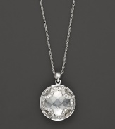 Faceted white quartz and white sapphires, set in sterling silver, form an elegant Maltese cross. By Elizabeth Showers.